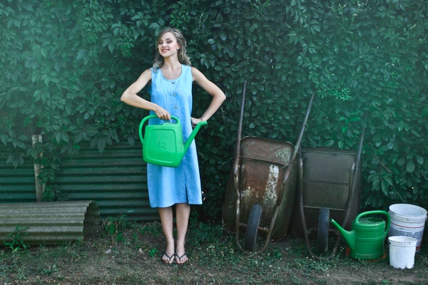 woman holding watering can